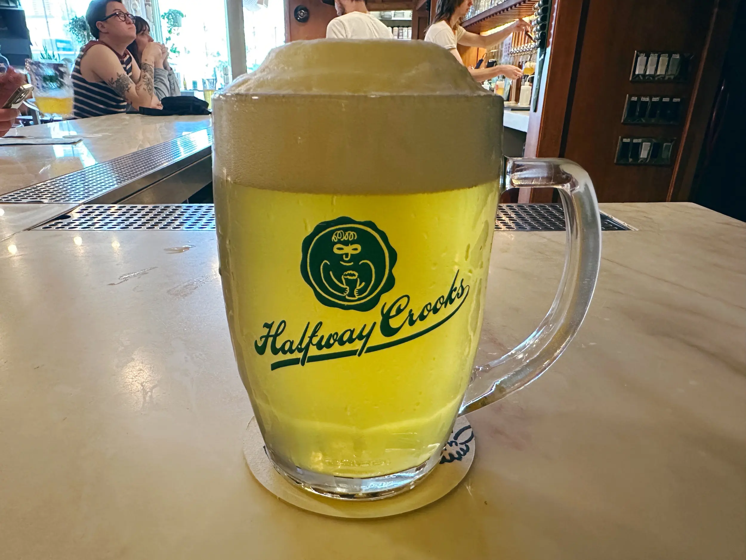 Photo of a mug of beer with the words Halfway Crooks