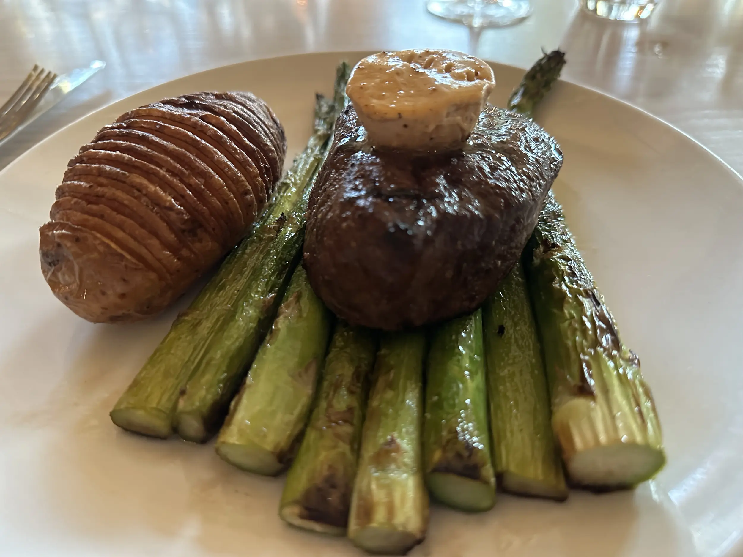 Photo of a steak, asparagus, and potatoes