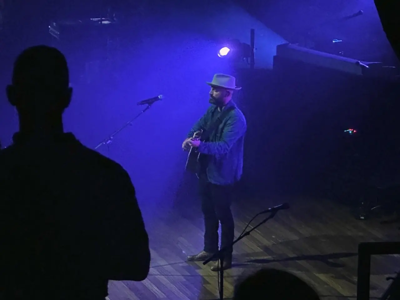 Photo of Drew Holcomb on stage