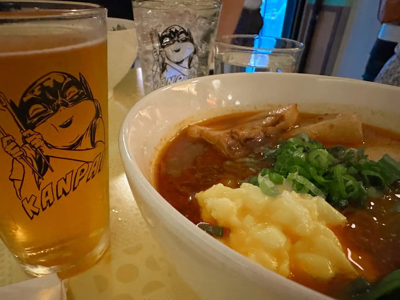 Photo of ramen and a beer