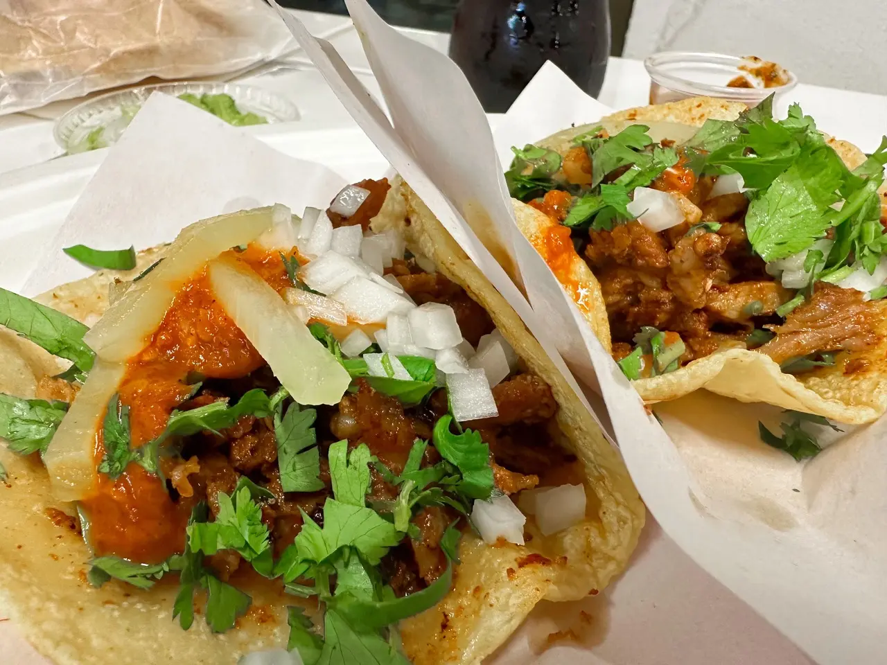 Photo of tacos and a coke bottle