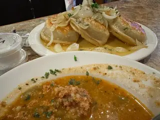 Photo of soup and pierogis 