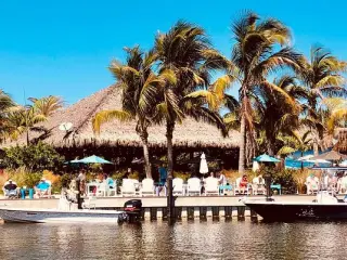 Photo of a tiki restaurant, shot from the water